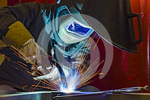 Industrial steel welder in factory