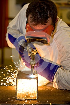 Welder Cutting with Flame