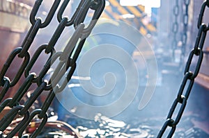 Welder doing welding on deck of ship lashing cargo