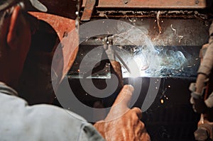 Welder, erecting technical steel. Industrial steel welder. Craf
