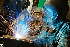 Welder at factory workshop