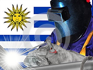 Welder and flag of Uruguy