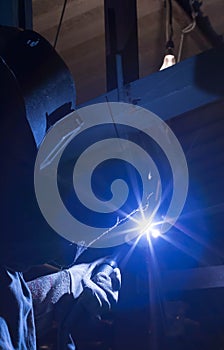 Welder industrial in factory welding process TIG with gas argon Inert gas, light spark.