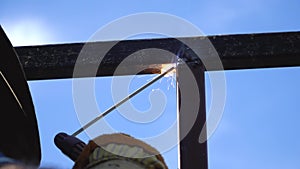 Welder man working Spark welding of iron construction