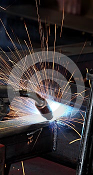 A welder in a metal fabrication facility.