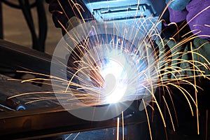 A welder in a metal fabrication facility. photo