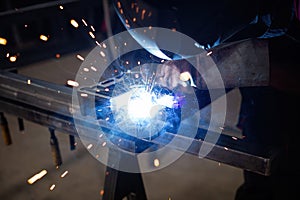 welder, mig or tig welding, craftsman, erecting technical steel Industrial, pretty sparks from weld pistol, steel welder in