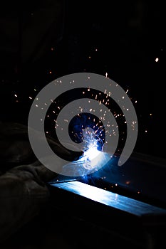 welder, mig or tig welding, craftsman, erecting technical steel Industrial, pretty sparks from weld pistol, steel welder in