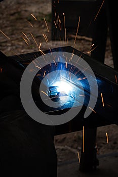 welder, mig or tig welding, craftsman, erecting technical steel Industrial, pretty sparks from weld pistol, steel welder in