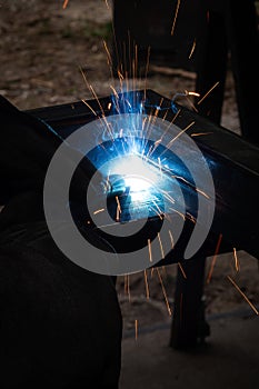 welder, mig or tig welding, craftsman, erecting technical steel Industrial, pretty sparks from weld pistol, steel welder in