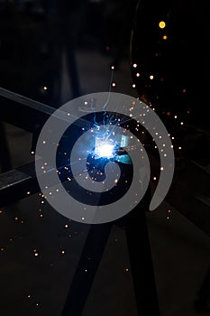 welder, mig or tig welding, craftsman, erecting technical steel Industrial, pretty sparks from weld pistol, steel welder in