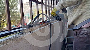 The welder performs semi-automatic electric arc welding. Welding of a metal structure. Working labor. Production and construction