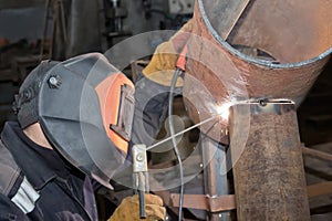 Welder in the shop weld of the sample insert tube into the pipe