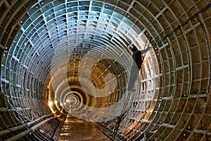 Welder at underground subway construction site