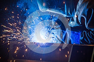 Welder uses torch