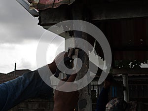 The welder using electrode welding the steel frame with welding machine, Welding sparks light and smoke