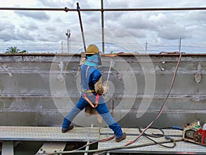 Welder are using heating torch to pre heat of steel structure before welding