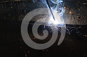 Welder Welding Sparks steel in factory