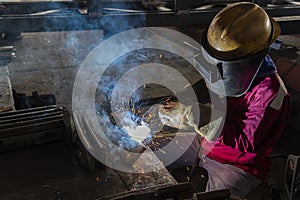 The welder is welding a steel structure work