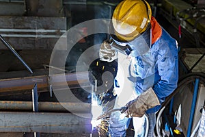 The welder is welding a steel structure work