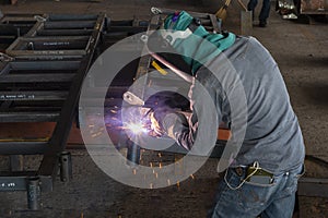 The welder is welding a steel structure work