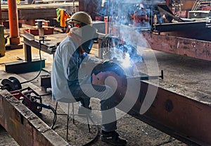 The welder is welding a steel structure work