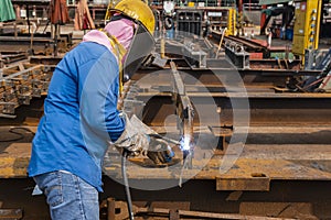 The welder is welding a steel structure work