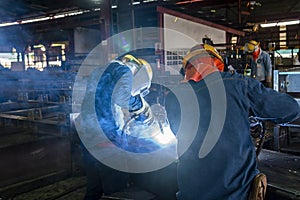 The welder is welding a steel structure work