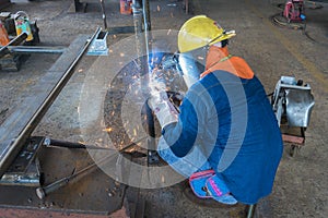 The welder is welding a steel structure work