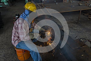 The welder is welding a steel structure work