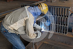 The welder is welding a steel structure work