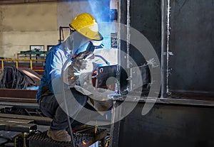 The welder is welding a steel structure work