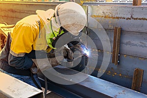 The welder is welding a steel structure work