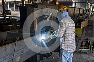 The welder is welding a steel structure work