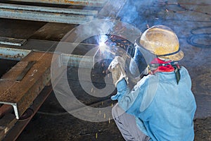 The welder is welding a steel structure work