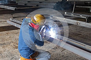 Welder is welding a steel structure work