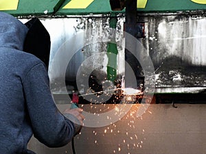 Welder at work with arch type equipment