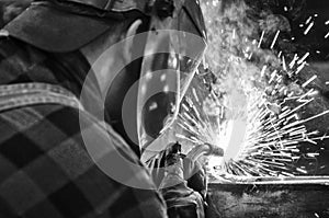 Welder at work, welding iron