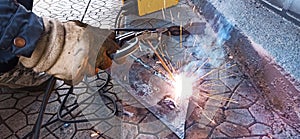 welder at work  welding metal platter
