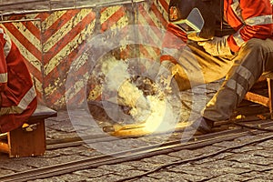 Welder at work, welding  tram rails.