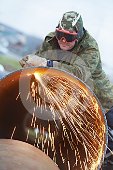 Welder worker with flame torch cutter