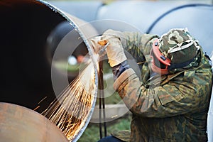 Welder worker with flame torch cutter