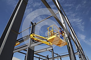 Welder Working From Cherry Picker