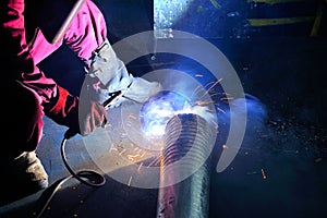 Welder working in factory