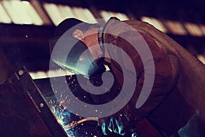 Welder working at factory