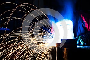 Welder working in a factory