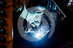 Welder working in factory