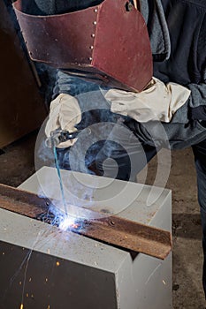 Welder working factory welding the metal