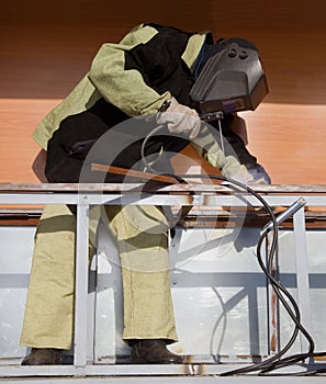 Welder working with a metal structure