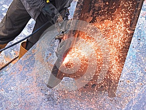 A welder working with metal structure